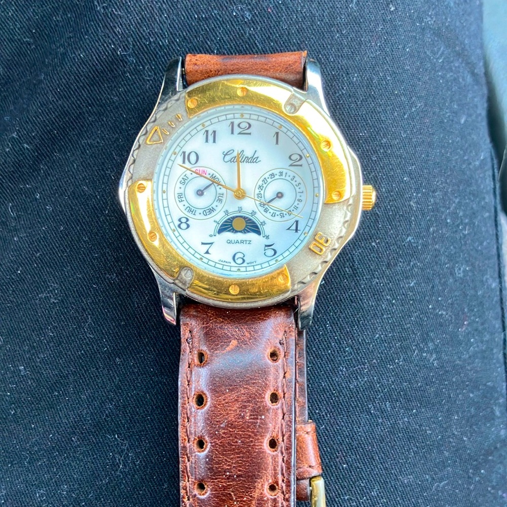 Calinda mans watch gold tones leather band very good condition